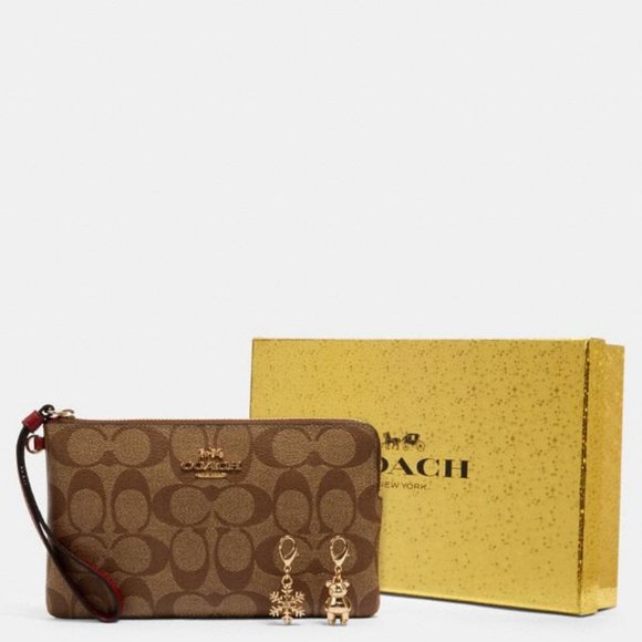 Coach Handbags - Coach Zip Brown  Wristlet in Signature Canvas